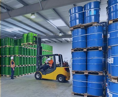 Chemical drums in a warehouse